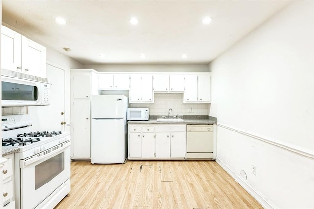 395 Merrimack St Unit 35, Methuen, MA 01844 - kitchen featuring white appliances, light wood-style floors, decorative backsplash, white cabinets, and recessed lighting