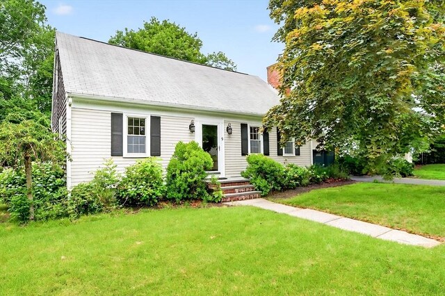 9 Arrowhead Ln, Dartmouth, MA 02748 - cape cod home featuring a front yard and a chimney
