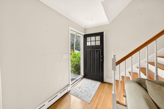 9 Arrowhead Ln, Dartmouth, MA 02748 - foyer featuring light wood-type flooring, a baseboard radiator, crown molding, and stairs