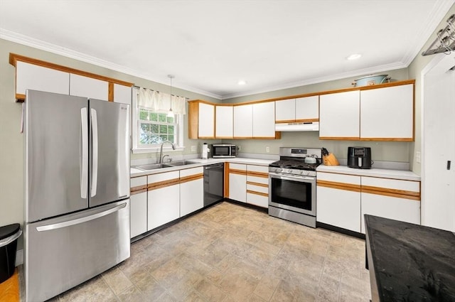9 Arrowhead Ln, Dartmouth, MA 02748 - kitchen featuring stainless steel appliances, under cabinet range hood, light countertops, ornamental molding, and white cabinets