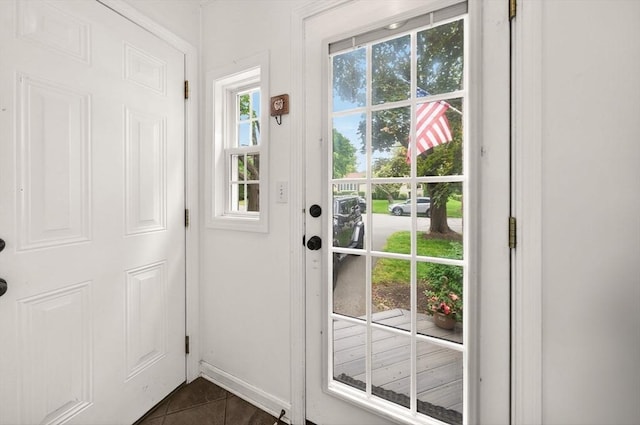 9 Arrowhead Ln, Dartmouth, MA 02748 - entryway featuring dark tile patterned flooring and baseboards