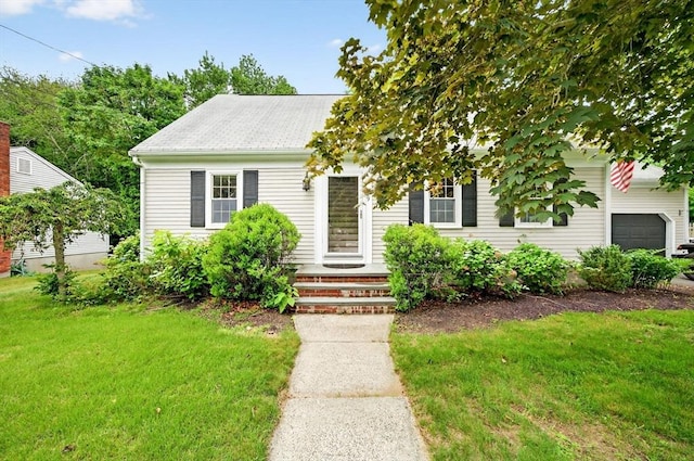 9 Arrowhead Ln, Dartmouth, MA 02748 - view of front of house featuring a front yard and a garage