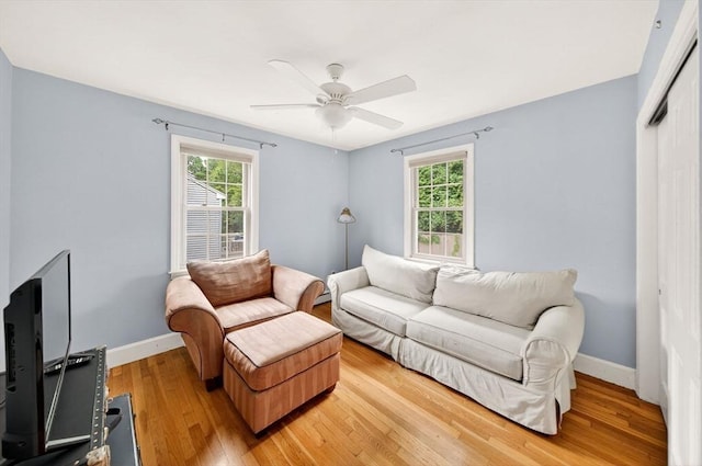 9 Arrowhead Ln, Dartmouth, MA 02748 - living area featuring healthy amount of natural light, light wood-style flooring, and a ceiling fan