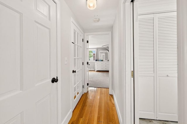 9 Arrowhead Ln, Dartmouth, MA 02748 - hall featuring light wood finished floors and a baseboard radiator
