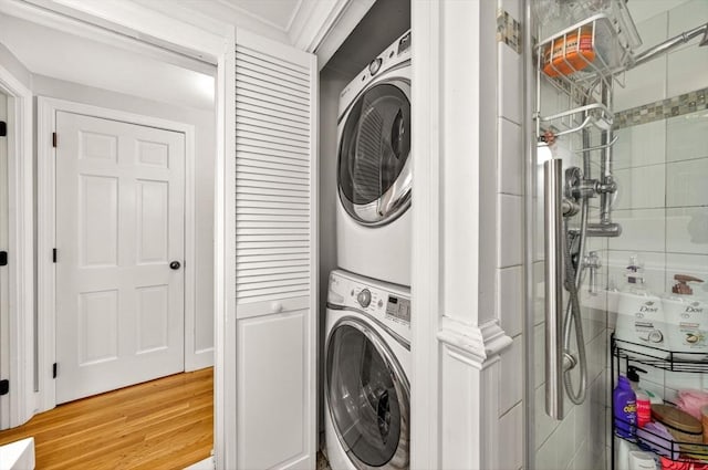 9 Arrowhead Ln, Dartmouth, MA 02748 - washroom with stacked washer / drying machine and light wood-style floors