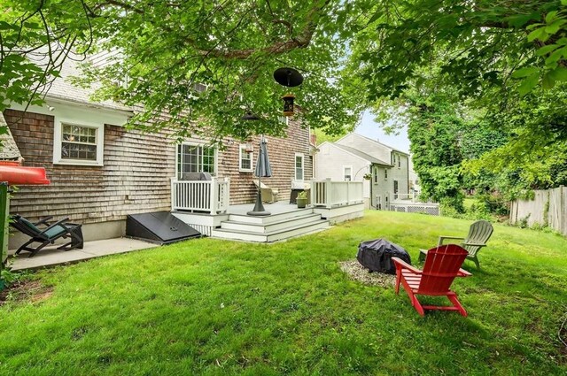 9 Arrowhead Ln, Dartmouth, MA 02748 - view of yard featuring a wooden deck and a fire pit