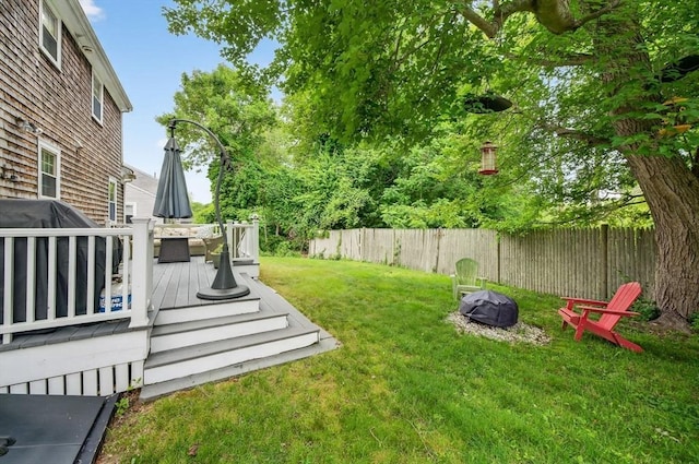 9 Arrowhead Ln, Dartmouth, MA 02748 - fenced backyard with a deck and a fire pit