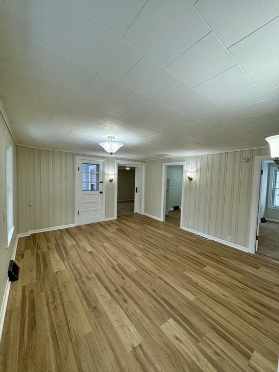 unfurnished living room featuring light wood-type flooring