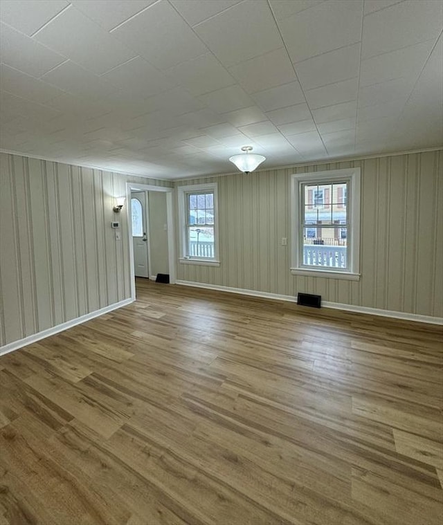 spare room featuring light wood-type flooring