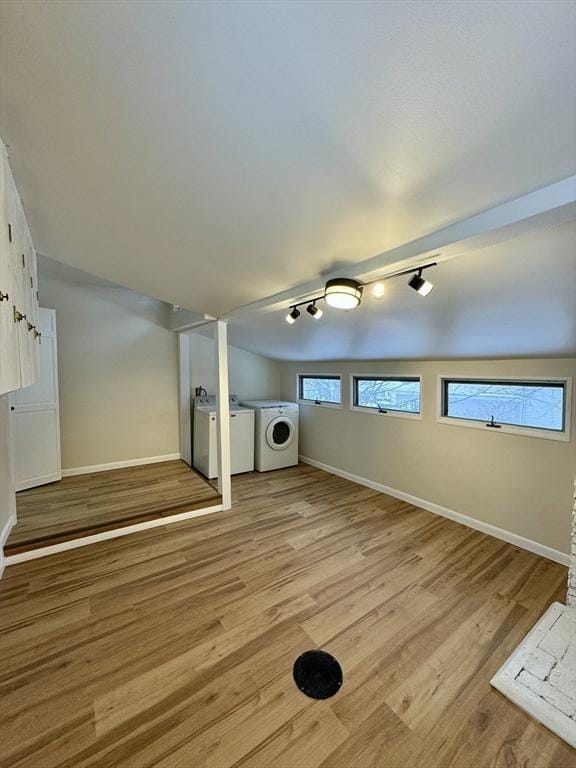 interior space featuring washer and clothes dryer and light hardwood / wood-style floors