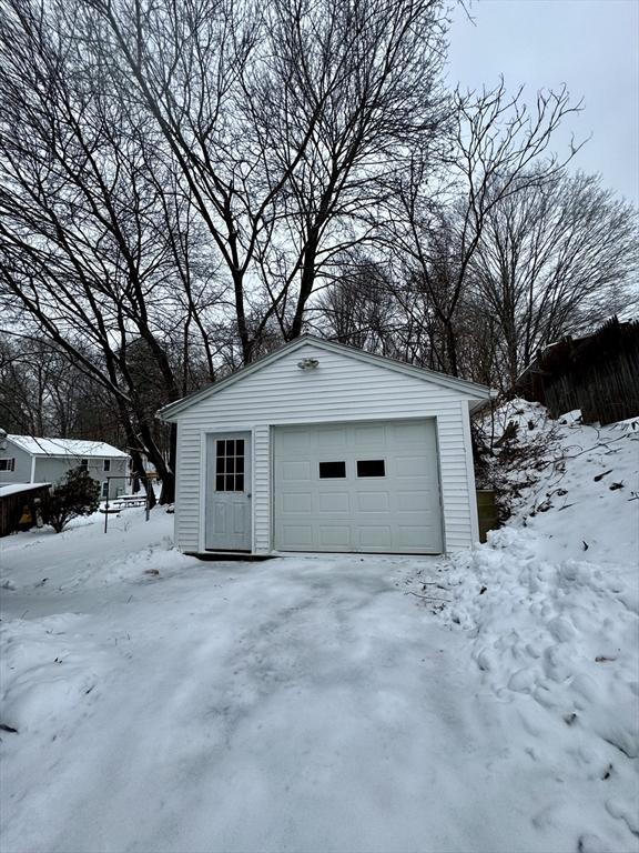 view of snow covered garage