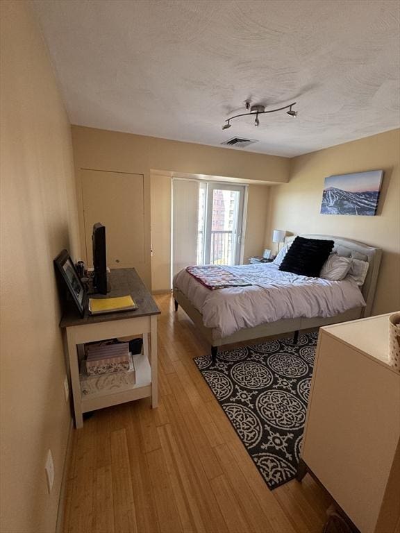 133 Commander Shea Blvd Unit 614, Quincy, MA 02171 - bedroom with light wood-style flooring