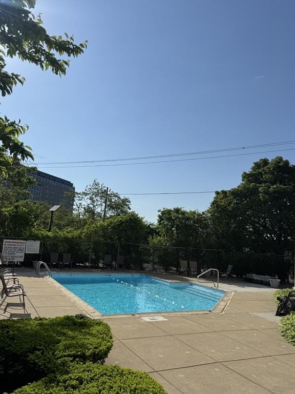 133 Commander Shea Blvd Unit 614, Quincy, MA 02171 - community pool featuring a patio area