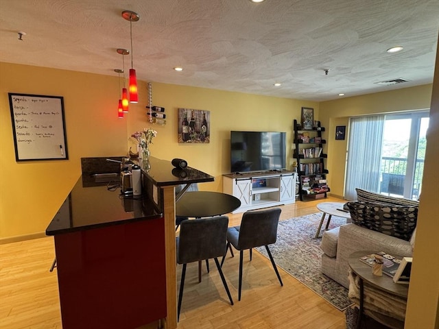 133 Commander Shea Blvd Unit 614, Quincy, MA 02171 - living room featuring light wood-type flooring, recessed lighting, and a textured ceiling