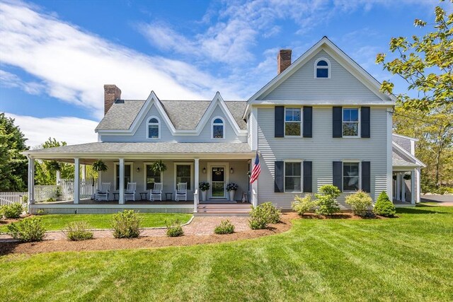 72 Oliver Snow Rd, Harwich, MA 02646 - view of front of house with a chimney, a front yard, a porch, and a shingled roof