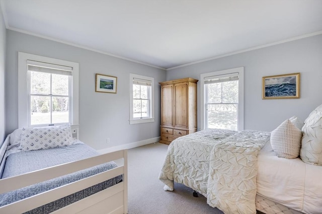 72 Oliver Snow Rd, Harwich, MA 02646 - bedroom featuring ornamental molding, multiple windows, light carpet, and baseboards