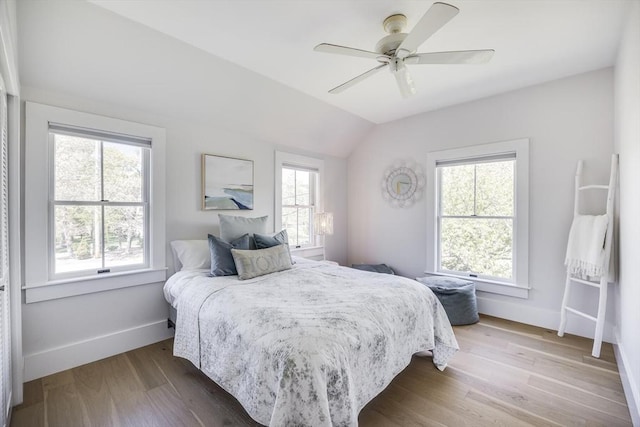 72 Oliver Snow Rd, Harwich, MA 02646 - bedroom featuring baseboards, lofted ceiling, wood finished floors, and a ceiling fan