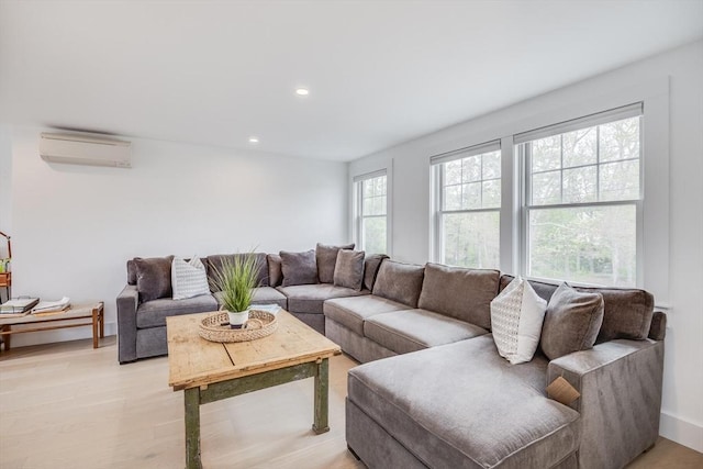 72 Oliver Snow Rd, Harwich, MA 02646 - living room with a wall mounted air conditioner, recessed lighting, and light wood-style floors