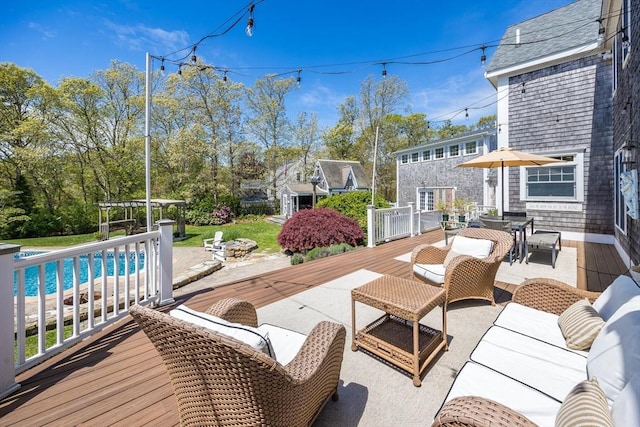 72 Oliver Snow Rd, Harwich, MA 02646 - view of patio with an outdoor pool, a wooden deck, an outdoor living space, and outdoor dining space