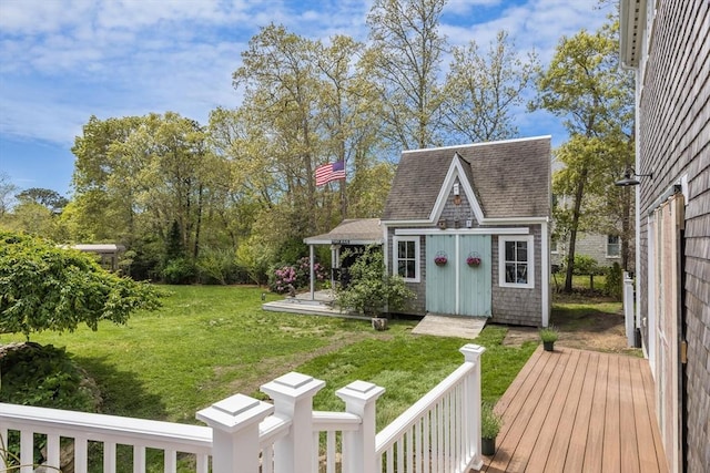 72 Oliver Snow Rd, Harwich, MA 02646 - view of grassy yard with a deck and an outdoor structure