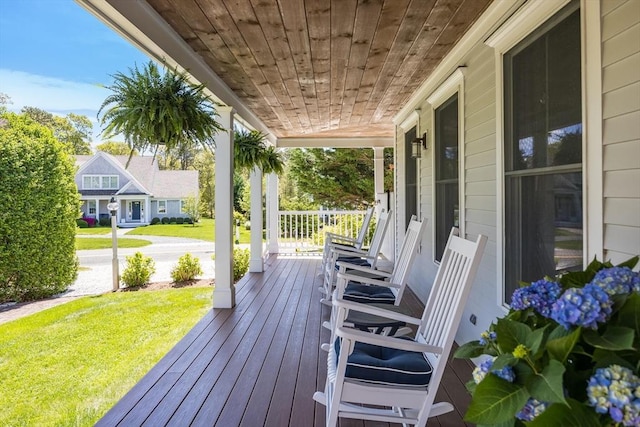 72 Oliver Snow Rd, Harwich, MA 02646 - wooden porch featuring a yard