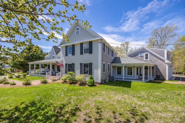 72 Oliver Snow Rd, Harwich, MA 02646 - rear view of house with a porch, a yard, and central air condition unit
