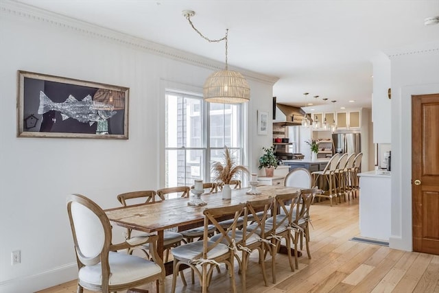 72 Oliver Snow Rd, Harwich, MA 02646 - dining area featuring light wood-style floors, ornamental molding, and recessed lighting