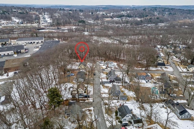 snowy aerial view with a residential view