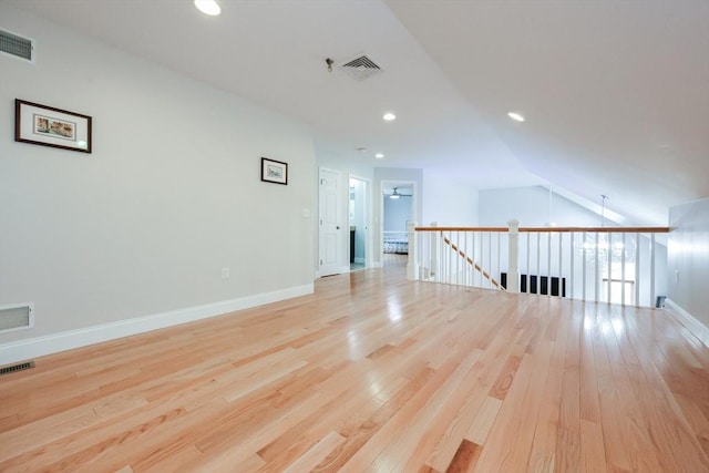 spare room featuring visible vents and wood finished floors