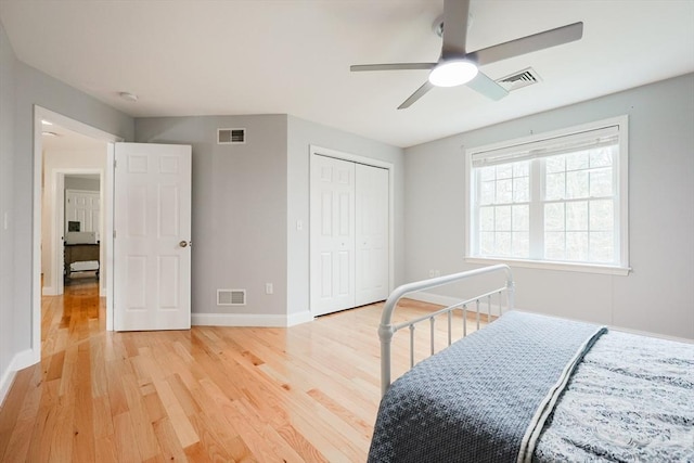bedroom featuring visible vents, baseboards, and light wood-type flooring