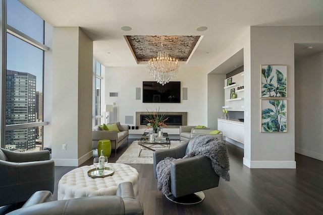 living room with dark wood-type flooring and a chandelier