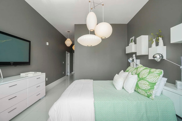 bedroom featuring light tile patterned floors