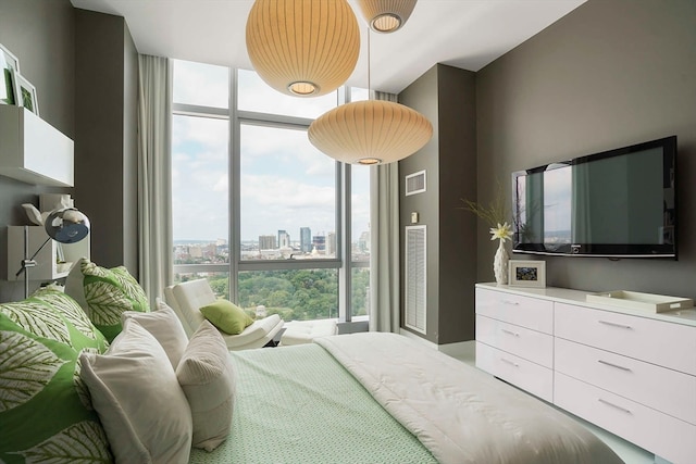 bedroom featuring floor to ceiling windows