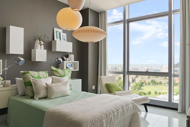 tiled bedroom with a wall of windows and multiple windows