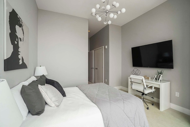 carpeted bedroom with a notable chandelier