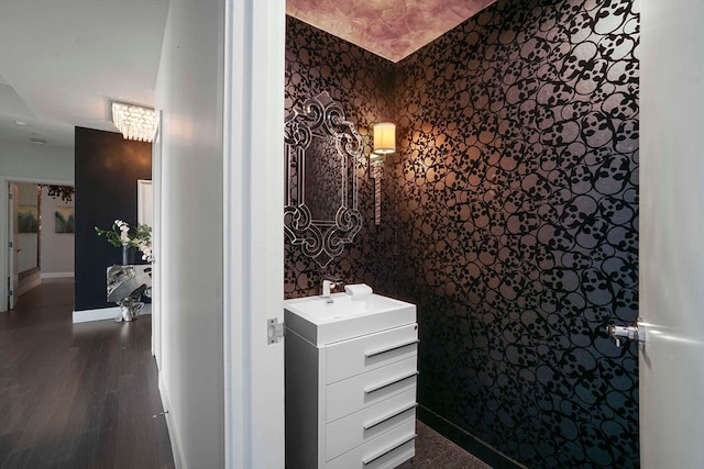 bathroom with hardwood / wood-style flooring and vanity