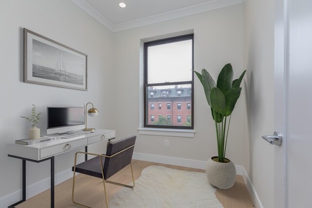 office area featuring ornamental molding and light hardwood / wood-style floors