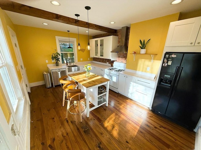 11 Hadwin Way Unit 11, Boston, MA 02131 - kitchen with black fridge, white gas stove, wall chimney exhaust hood, dishwasher, and beam ceiling