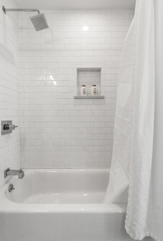 bathroom with shower / bath combination with curtain