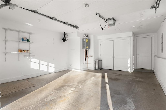 parking garage with baseboards, water heater, and a garage door opener