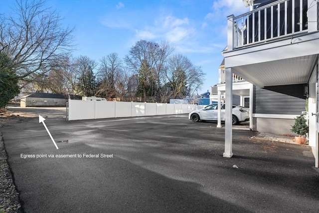 uncovered parking lot with fence