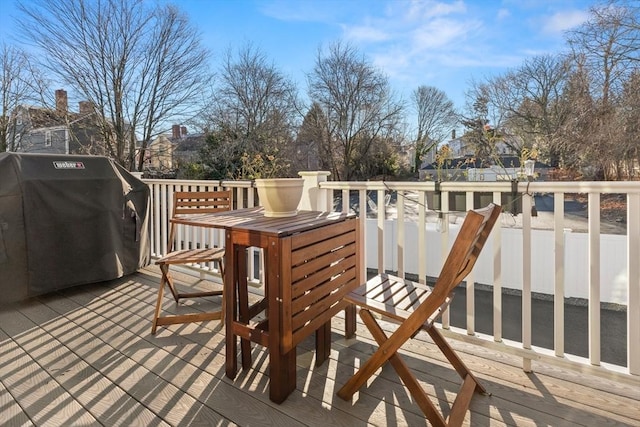 wooden terrace with area for grilling