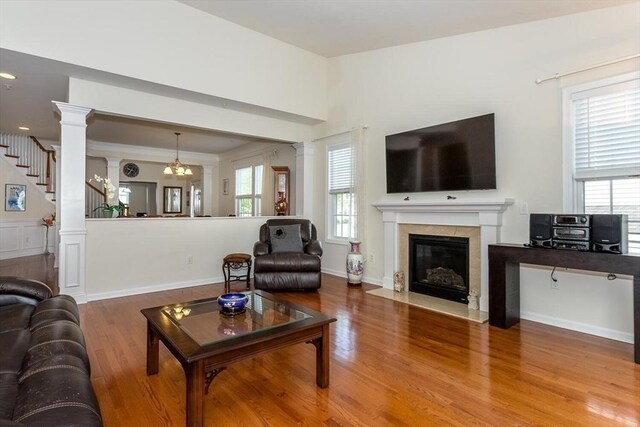 25 Kelly Way Unit 25, Canton, MA 02021 - living area with wood finished floors, a premium fireplace, decorative columns, and stairway