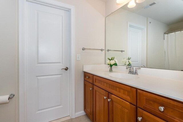 25 Kelly Way Unit 25, Canton, MA 02021 - bathroom with vanity, baseboards, and tile patterned floors