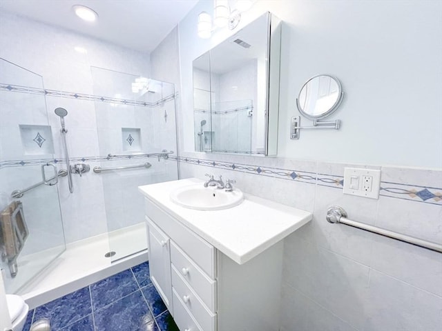 23 Hobart Ln Unit 23, Rockland, MA 02370 - full bathroom with a shower stall, vanity, tile patterned flooring, and tile walls