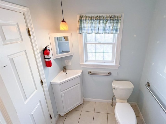 23 Hobart Ln Unit 23, Rockland, MA 02370 - bathroom featuring toilet, baseboards, tile patterned floors, and vanity