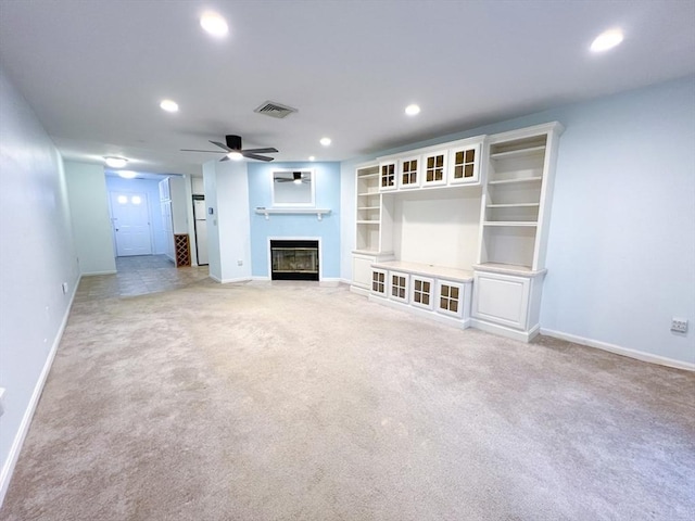 23 Hobart Ln Unit 23, Rockland, MA 02370 - unfurnished living room featuring a fireplace with flush hearth, light carpet, baseboards, a ceiling fan, and recessed lighting