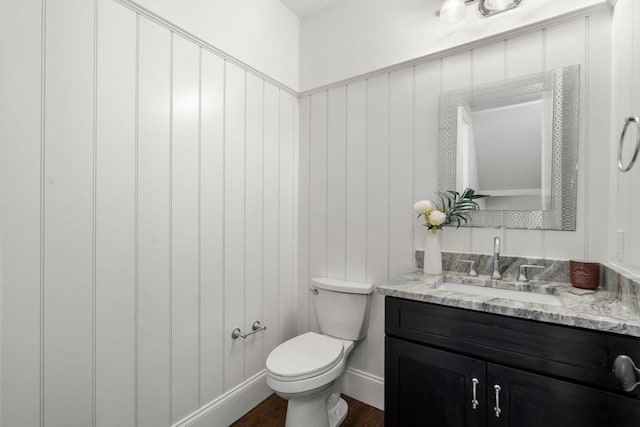 23 Troy Ln Unit 23, Newton, MA 02468 - bathroom with vanity, toilet, wood finished floors, and baseboards