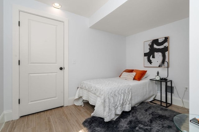 23 Troy Ln Unit 23, Newton, MA 02468 - bedroom with baseboards, wood finished floors, and recessed lighting