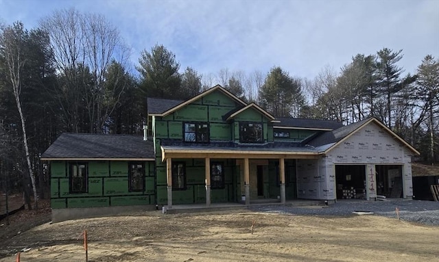 property in mid-construction featuring a garage and covered porch